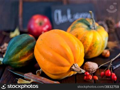 autumn pumpkin on a table, yellow pumpkin