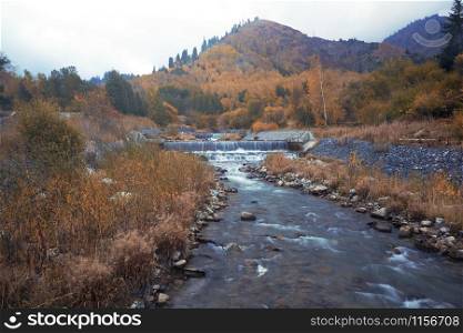 Autumn river in mountains. Horizontal photo