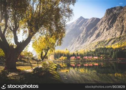 Autumn scene of morning in lower Kachura lake with mountains in the background and reflection in still water. Shangrila Skardu. Gilgit-Baltistan, Pakistan.