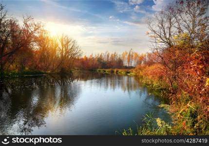 Autumn season on the calm river at sunrise