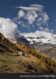 Autumn season with huge mountains and clouds