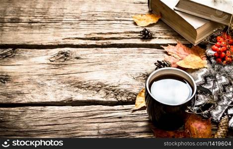 Autumn style. Coffee with an old books. On wooden background.. Autumn style. Coffee with an old books.