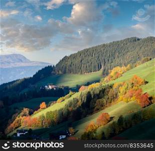 Autumn sunrise Santa Magdalena famous Italy Dolomites mountain village environs view in first sunlight. Picturesque traveling, seasonal and countryside beauty concept background.