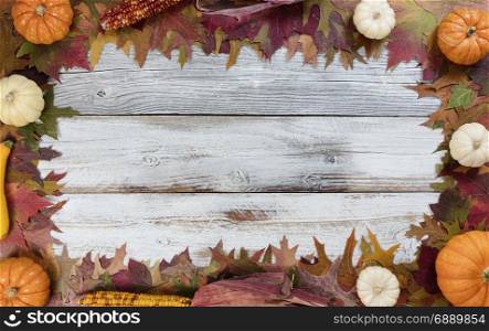 Autumn Thanksgiving foliage and seasonal vegetable decoration background