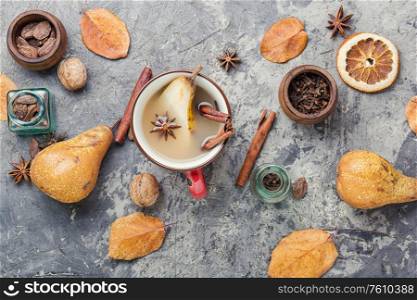 Autumn traditional popular mulled wine.Warm pear wine with spicy spices.. Pear alcoholic drink.