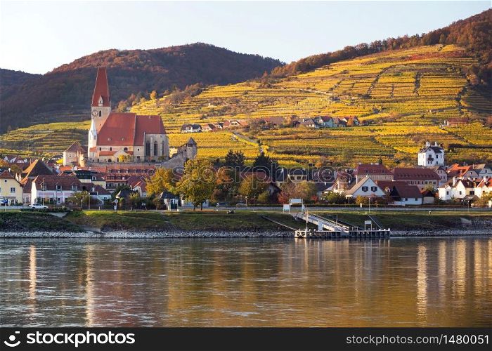 autumn view of small austrian village Weissenkirchen in der Wachau on a Danube river bank , district of Krems-Land, Wachau Valley, Austria