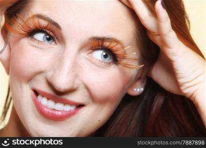 Autumn woman fashion female stylish creative make up false long brown eye lashes autumnal colour. Close up portrait