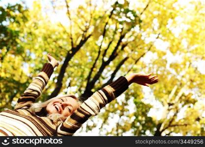 autumn woman hands in the air