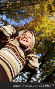 autumn woman hands in the air