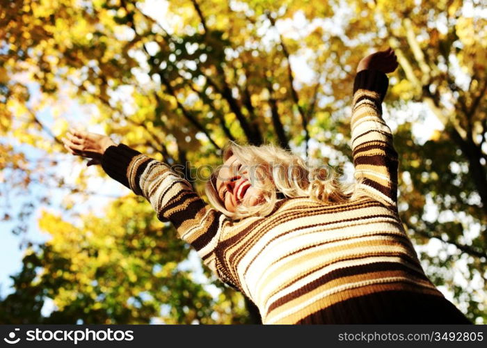 autumn woman hands in the air