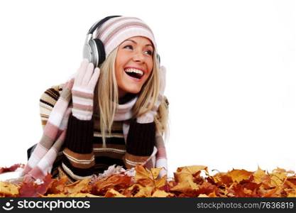 autumn woman listening music in studio isolated on white background. autumn woman listening music
