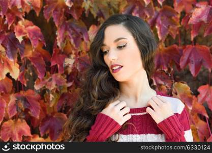 Autumn Woman Portrait. Beauty Fashion Model Girl with Autumnal Make up and Hair style. Fall