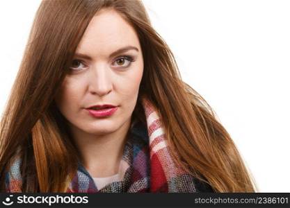 Autumnal outfit concept. Young long haired woman wearing warm autumn clothing woolen checked scarf isolated on white. Woman wearing woolen checked scarf warm autumn clothing