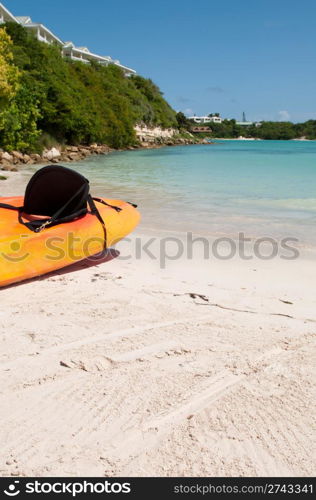 available orange kayak on a white sandy beach, Long Bay in Antigua