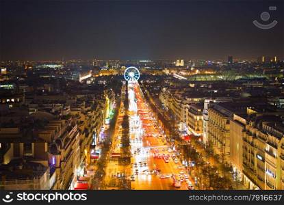 Avenue Champs-Elysees and ferris wheel in Paris, France. View from Triumphal Arch