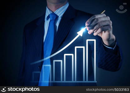 Average sales dynamics. Chest view of businessman drawing with pencil increasing graph