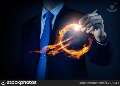 Average sales report. Close view of businessman drawing on screen burning euro sign