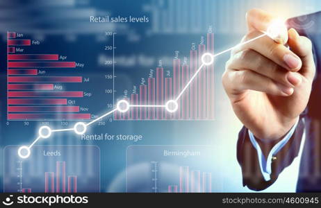 Average sales report. Close view of businessman drawing on screen market infographs