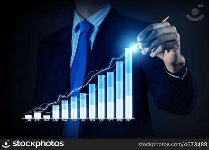 Average sales report. Close view of businessman drawing on screen market infographs