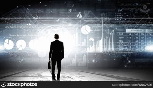 Average sales report. Rear view of businessman with suitcase and infographs on virtual panel