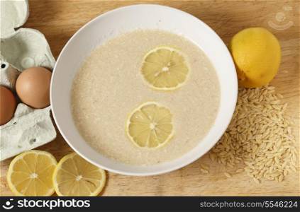Avgolemono soup - made with chicken broth, lemon, egg and rice-shaped pasta. This is a very traditional Greek dish.