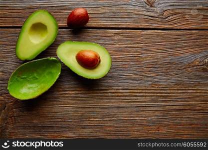 avocado cut on aged wood table board cutted half