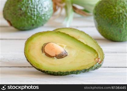Avocado in a kitchen on a wooden desk