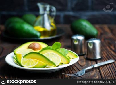 avocado salad on plate and on a table