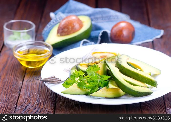 avocado salad on white plate and on a table