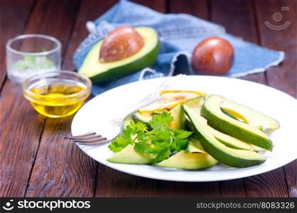avocado salad on white plate and on a table