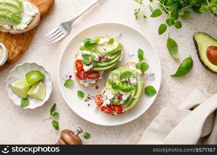 Avocado toast with cheese cottage, tomato and herbs for breakfast