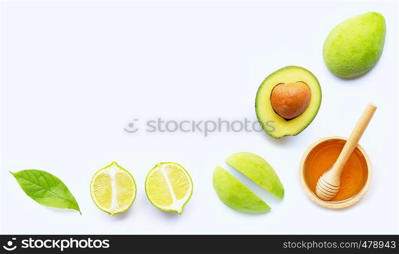 Avocado with honey on white background. Top view, Copy space