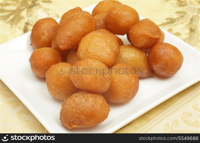 Awama or awamat, Middle Eastern syrup-soaked fried sponge ball which is a common Ramadan treat and a Lebanese dessert
