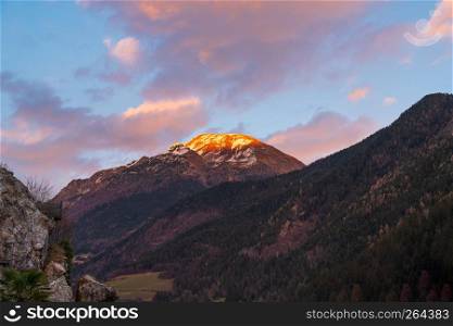Awesome panorama of the snow-covered Orobie mountains of the Seriana Valley and the Sedornia Valley at sunset.