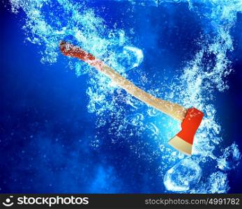 Axe under water. Axe tool sink in clear blue water