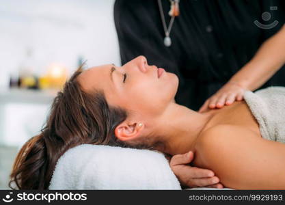 Ayurveda Massage Treatment. Massaging Shoulders with Ayurvedic Essential Oils 