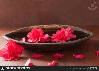 azalea flowers in bowl for aromatherapy spa
