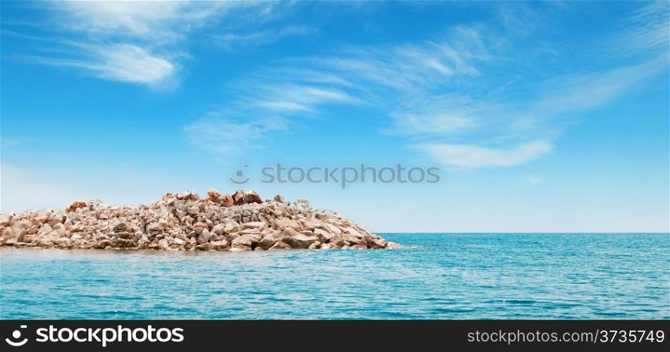 azure sea and the rocky island