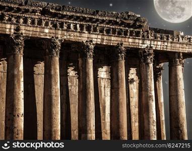 Baalbeck castle in the night, beautiful full moon and starry sky, ancient arabian architecture, religious building, travel and tourism concept