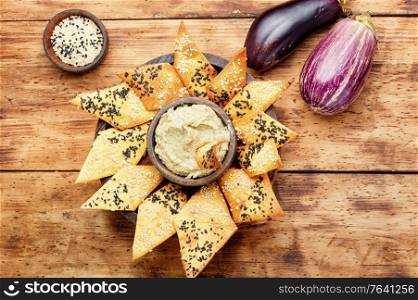 Babaganush or eggplant caviar from baked eggplant.Eggplant baba ganoush with flat bread. Eggplant baba ganoush
