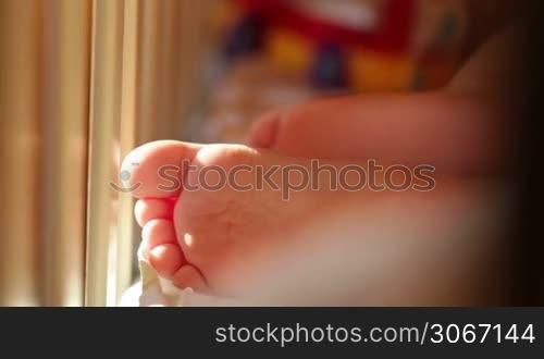 Baby&acute;s foot. Closeup. Sunlight.