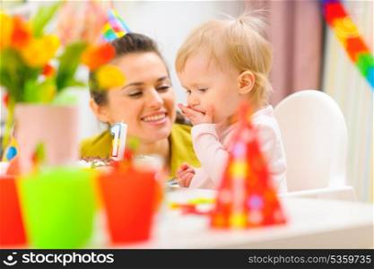 Baby and mother partying first birthday