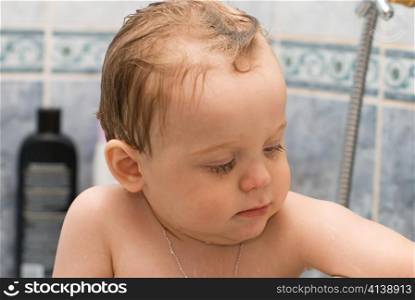 Baby bathes in the bath