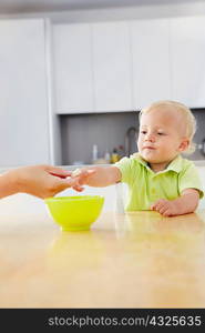 Baby boy having a snack