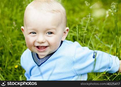 baby boy in meadow