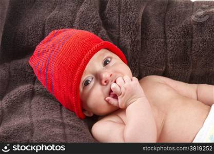 baby boy over brown blanket on white background