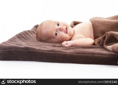 baby boy over brown blanket on white background