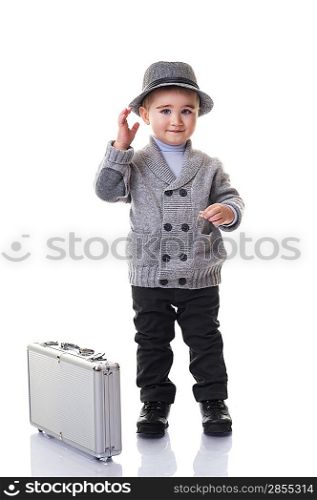 Baby boy with a silver suitcase.