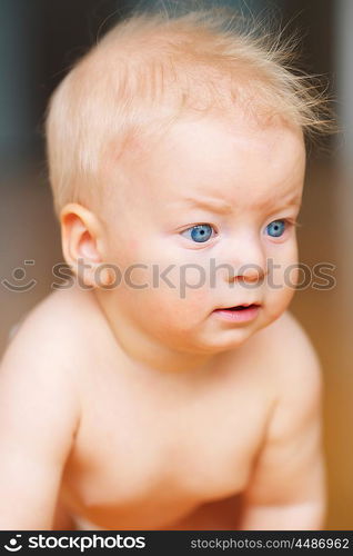 Baby boy with blue eyes portrait