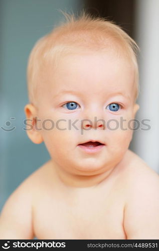 Baby boy with blue eyes portrait